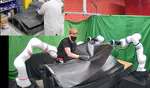 A Multi-Arm Robotic Assistant for Sheet Manipulation and Draping
